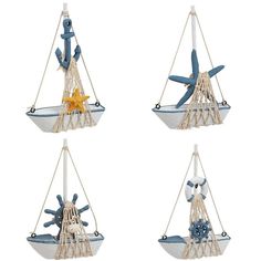 four different types of toys hanging from ropes on the wall, including a sailboat and starfish