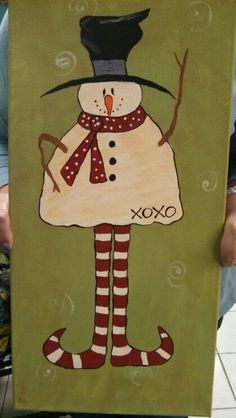 a painting of a snowman wearing a top hat and striped stockings holding a sign