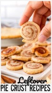 a person is holding a cinnamon roll in front of some pie crusts on a white plate