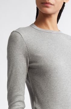 The label's sought-after simplicity pervades a long-sleeve top knit in Portugal from soft and stretchy organic cotton. 26 1/2" length (size Medium) Crewneck Long sleeves 93% organic cotton, 7% elastane Dry clean Made in Portugal Designer Clothing Fitted Long Sleeve Sweater For Work, Classic Fitted Cotton Knit Top, Cotton Knit Top With Ribbed Neckline And Long Sleeves, Fitted Long Sleeve Sweater For Layering, Classic Long Sleeve Knit Top, Fitted Fine Knit Long Sleeve Crew Neck Top, Fitted Long Sleeve Fine Knit Sweater, Classic Long Sleeve Ribbed Knit Top, Fitted Fine Knit Long Sleeve Sweater