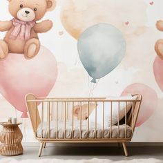 a teddy bear sitting on top of a bed next to a baby crib with balloons