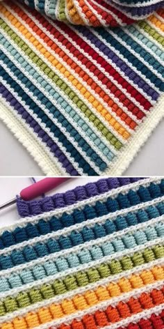 the crocheted blanket is being worked on with scissors and yarn in different colors