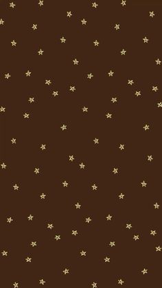 a brown background with gold stars on it