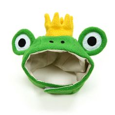 a green frog with a crown on its head and big eyes is shown in front of a white background