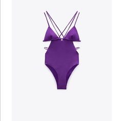 Swimsuit With Removable Cups, V-Neckline, And Double Cross-Back Straps. Cut Out Details At Waist. Spring V-neck Cutout Swimwear, Purple V-neck Swimwear With Lined Body, Zara Stretch Swimwear For Party, Spring Party Swimwear With Cutout, Purple Party Swimwear For Spring, Spring Party Cutout Swimwear, Purple Backless Swimwear For Party, Purple Backless Party Swimwear, Chic Purple Swimwear