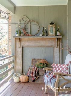 a room with a fire place and chairs on the porch