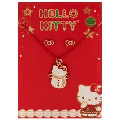 a hello kitty necklace and earrings set on a red card with gold foil lettering that says hello kitty