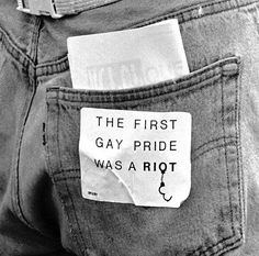 the first gay pride was a riot sticker on someone's back pocket in this black and white photo