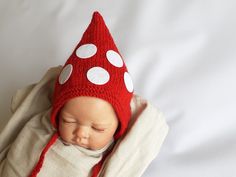 NEW design in my shop- a newborn mushroom gnome bonnet hat- a perfect mushroom baby shower accessory, an adorable newborn baby's first Valentine's Day cap/costume, a cute fall cottagecore/ mushroomcore infant toadstool mushroom hat that will make everyone smile!  Perfect for woodland-themed newborn photo sessions, Halloween photo shoots or a unique new baby gift. I can make the gnome hat in any color but the felt circles are at the moment available in beige and white colors. A lovely newborn kni Cute Hand Knitted Bonnet As A Gift, Cute Hand Knitted Bonnet As Gift, Cute Hand Knitted Bonnet, Hand Knitted Hats As Gifts, Playful Knitted Hats For Gift, Playful Hand Knitted Hat As Gift, Playful Hand-knitted Hats As Gifts, Halloween Photo Shoots, Knit Gnome