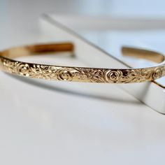 This thick gold filled floral open bangle is perfect for wearing alone or mixing and matching with your other cuffs.This open bangle was hand fabricated in Melt'm Jewelry Studio in CaliforniaNow we are offering engraving inside to our bracelets! DETAILS ABOUT THE BRACELET*** Gold filled floral bracelet is 5.2mm wide and 1.8mm thickness. *** You can choose your font from the 3rd pic or you can even send me your font request.*** To engrave your actual handwriting, please send a photo via Etsy conv Bracelet Flowers, Message Bracelet, Floral Bracelet, Topaz Jewelry, Tourmaline Jewelry, Open Bangle, Aquamarine Jewelry, Garnet Jewelry, Gold Cuffs