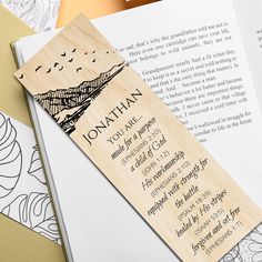 a wooden bookmark with an image of a mountain