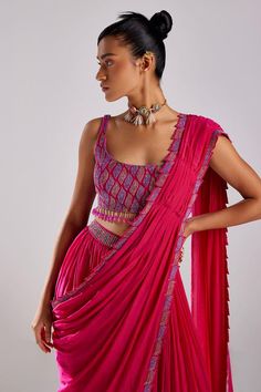 Fuchsia pink pre-draped saree in cotton silk, crepe base with cut work border leaf embroidery using multi color cut dana beads. Paired with sleeveless multi color cut dana leaf embroidered blouse with dangling glass beads on the hem.
Components: 2
Pattern: Embroidery
Type Of Work: Cut dana leaf
Neckline: Square
Sleeve Type: Sleeveless
Fabric: Cotton Silk and Crepe, Lining: Shantoon
Color: Pink
Other Details: 
Dangling glass bead tassels on blouse hem
Occasion: Sangeet, Mehendi and Haldi - Aza Fa Pink Draped Set For Festive Occasions, Pink Draped Sets For Festive Occasions, Festive Draped Pink Set, Festive Pink Draped Set, Designer Wear Pink Draped Dupatta, Designer Pink Draped Dupatta, Pink Draped Designer Wear Dupatta, Designer Draped Pink Choli, Pink Draped Lehenga With Dupatta