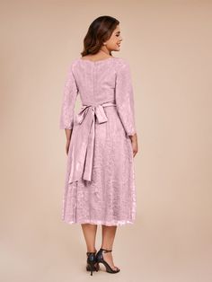 This exquisite A Line Tea Length dress features delicate lace and elegant sleeves, perfect for a mother of the bride. The bow tie back adds a touch of sophistication to the classic silhouette. Feel confident and graceful in this beautiful and timeless dress.    Attention!     The sleeves are see-through and unlined. (Refer to the picture below) Elegant Sleeves, White Wisteria, Tea Length Dress, Timeless Dress, Tea Length Dresses, Mother Of The Bride Dress, Tea Length, Classic Silhouette, Green Turquoise