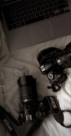 a camera and some other items on a bed