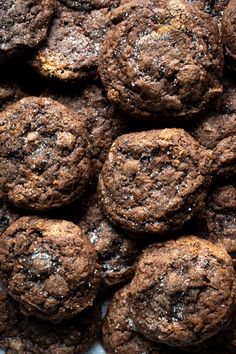 a pile of chocolate cookies sitting on top of a table