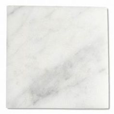 a square white marble tile on a white background