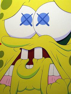 the spongebob face has two large eyes and is very angry with it's mouth wide open