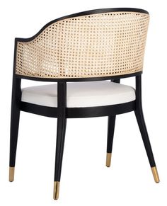 a white and black chair with gold trim