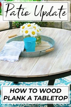 a wooden table with flowers on it and the words how to wood plank a tabletop