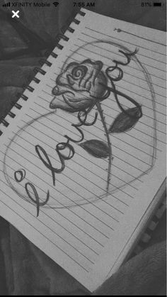 a drawing of a rose with the word roses written in cursive writing on lined paper