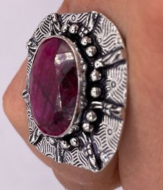 Vintage Raw Pink Ruby Deco Silver Cocktail Ring  Unusual deep toned raw Ruby low content silver setting handmade  size 8.5 Can be resized. My jeweler charges a $20 fee All rings are shipped in a nice gift box.   Check out our over a THOUSAND great reviews Engraving is $4 per letter and is not always perfect depending on the piece. It can take a few days if the jeweler is busy. This is payable to Paypal Judithsltd@gmail.com Artistic Hand Forged Rings For Gifts, Artistic Hand Forged Rings As Gift, Handmade Spiritual Ruby Ring As Gift, Handmade Spiritual Ruby Ring For Gift, Hand-forged Round Ruby Ring Gift, Handmade Collectible Ruby Ring, Handmade Oval Ruby Ring Collectible, Unique Silver Ruby Ring Gift, Handmade Oval Ruby Ring For Collectors