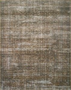 an area rug with different colors and patterns on the carpet, including brown, beige and white