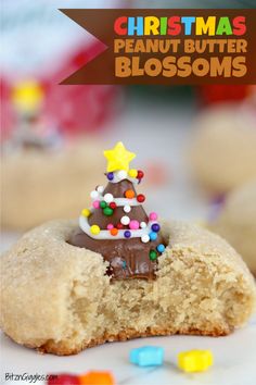 a chocolate christmas tree on top of a peanut butter blossom cookie with sprinkles