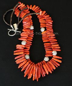 Hand-Built by Southwest Designs | Southwest Designs Handmade Multi-strand Red Coral Necklace, Double Strand Red Coral Necklace, Red Coral Double Strand Necklace, Bohemian Orange Double Strand Jewelry, Handmade Multi-strand Red Coral Jewelry, Orange Multi-strand Hand-strung Jewelry, Orange Hand-strung Multi-strand Jewelry, Adjustable Red Spiral Jewelry, Adjustable Coral Jewelry With Polished Beads