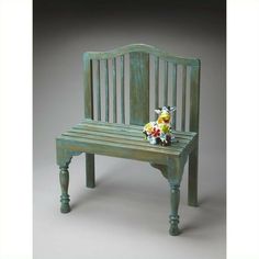 a wooden bench with flowers on it