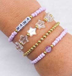 Light Purple Mama Bracelet 💟 - 4mm Light Purple Beaded Mama bracelet - Clear star bracelet w/ 14k gold filled ball spacers  - 14k gold filled ball bracelet - light purple smiley bracelet CARING TIPS FOR YOUR JEWELRY ⭐️Treat and store with care. ⭐️ For longevity, avoid exposing your jewelry to water. ⭐️ Avoid having direct contact with lotions, perfumes, sanitizers as these chemicals may cause discoloration of your jewelry. Mardi Gras Bracelet, Ivy Jewelry, Smiley Bracelet, Stacked Beaded Bracelets, Mama Bracelet, Preppy Bracelets, Mom Bracelet, Moms Bracelet, Beads Jewellery