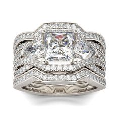 a white gold ring with two rows of diamonds on the band and a princess cut diamond in the center