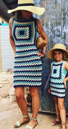 a woman and child wearing matching crocheted outfits