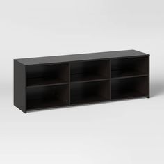 a black shelf with several compartments on it