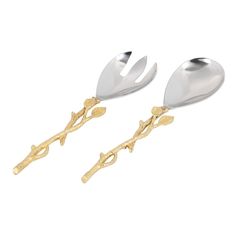 two silver and gold serving spoons with leaves on each side, one is holding a fork