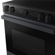 a black oven with the door open on an isolated white background