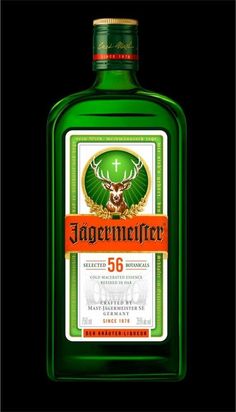 a bottle of jagermeister green liquor with a deer head on the front and an orange ribbon around the neck