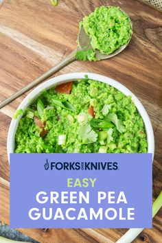 green pea guacamole in a white bowl with spoons on the side