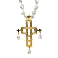 Product Description: This stunning necklace features lustrous baroque pearls, each uniquely shaped and naturally beautiful, creating a piece that is both distinctive and versatile .Adding a touch of opulence and spiritual symbolism, the necklace is adorned with a gold cross charm. This cross is crafted from high-quality gold, offering a radiant contrast to the creamy pearls. The cross adds a meaningful and elegant touch, making this necklace not only a piece of jewelry but also a symbol of faith and grace. *Please note: This is a vintage item and not in perfect condition. Dimensions: 24" Pearl Size: 16mm Cross Pendant: 5" Drop Style #: VBPCN24 Gold Cross Necklace, Gold Cross, Cross Charms, Stunning Necklace, Pearl Size, Baroque Pearls, Cross Pendant, Cross Necklace, Vintage Items