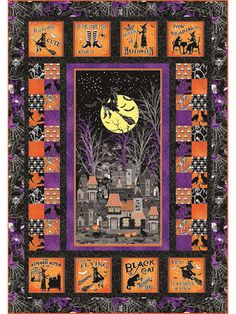 a halloween quilt with an image of a house and pumpkins in the night sky