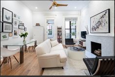 a living room filled with furniture and a fire place