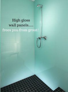 there is a glass shower wall in the bathroom with words on it that say high gloss walls, frees you from grout