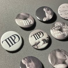 six buttons with the words t p d and images of women in black and white