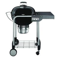 a black barbecue grill with the lid on it's side and two burners