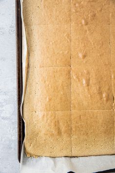 an uncooked loaf of bread sitting on top of a baking sheet in a pan