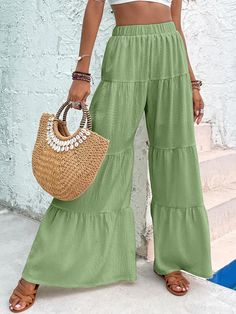 Unleash your inner free spirit with our Boho Ruffled Hem Wide Leg Pants! The flowy and comfortable design will keep you cool and stylish, while the ruffled hem adds a touch of bohemian charm. Perfect for any occasion, these pants will bring out your unique and adventurous side. 100% Polyester Brand Size Dress Bust Waist Hip XS 0-2 31-32.5'' 23-24'' 31-34" S 4--6 33-35'' 25-26'' 35-37" M 8--10 35-36'' 27-28'' 38-39" L 12--14 38-40'' 29-31'' 40-42" XL 14-16 40-42'' 33.5-36'' 44-46" 2XL 18-20 42-44 Bohemian Summer Pants In Solid Color, Casual Ruffled Trousers, Bohemian Summer Pants, Ankle-length Bottoms For Beach, Green Ruffled Bottoms For Day Out, Summer Wide Leg Bottoms With Ruffle Hem, Summer Solid Color Flare Bottoms, Flare Bottoms In Solid Color For Summer, Solid Flare Bottoms For Summer