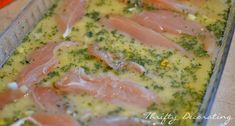 raw fish in broccoli and parsley sauce in a pan on a counter