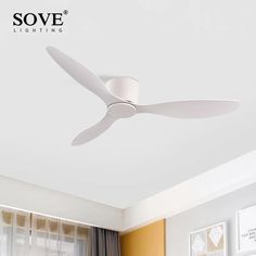 a white ceiling fan in a living room