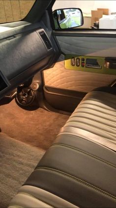 the interior of a car with leather seats