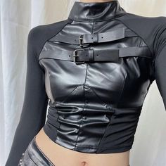 𝔇𝔢𝔱𝔞𝔦𝔩𝔰: Style: Cyberpunk, Darkwear, Techwear, Streetwear Material: Leather, spandex High-quality punk style leather top with metal buckle Super stretchable, it fits your body perfectly without making you feel rigid Enjoy free shipping with a purchase of over 80$ SIZE LENGTH CHEST SLEEVE WAISTS 15 in 29-33 in 26 in 24 inM 16 in 31-35 in 26 in 25 inL 16 in 32-36 in 27 in 27 inItem measured by hands may have 1-2 in differences.SIZE LENGTH CHEST SLEEVE WAISTS 39 cm 74-84 cm 66 cm 60 cmM 40 c Alternative Fitted Tops For Cosplay, Fitted Alternative Top For Cosplay, Fitted Alternative Style Top For Cosplay, Black Faux Leather Club Top, Black Faux Leather Top For Club, Black Faux Leather Party Tops, Edgy Fitted Faux Leather Top, Fitted Faux Leather Edgy Tops, Fitted Punk Top For Night Out