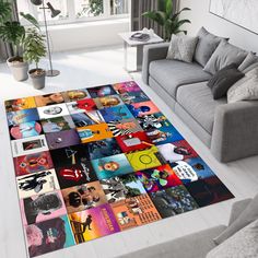 a living room area with a couch, chair and rug covered in various pictures on the floor